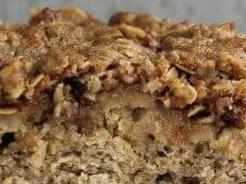 A-slice-of-apple-oatmeal-coffee-cake-with-a-glass-of-milk-and-napkin